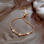 Pulsera Ajustable Dorada con Piedras Ojo de Gato y Circonitas S129