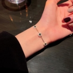 Pulsera Cadena Dorada con Dijes Trébol Verde Esmeralda y Strass S145