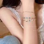 Pulsera Dorada Doble Hilera con Cristales Turquesa y Dijes S653