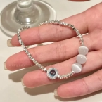 Pulsera Plateada de Cuentas Facetadas con Ojo Místico y Piedras Luna S658