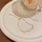Pulsera Dorada Ajustable Mariposa y Flores con Circonitas S744