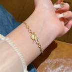 Pulsera Dorada Planeta Saturno con Ojo de Gato S757